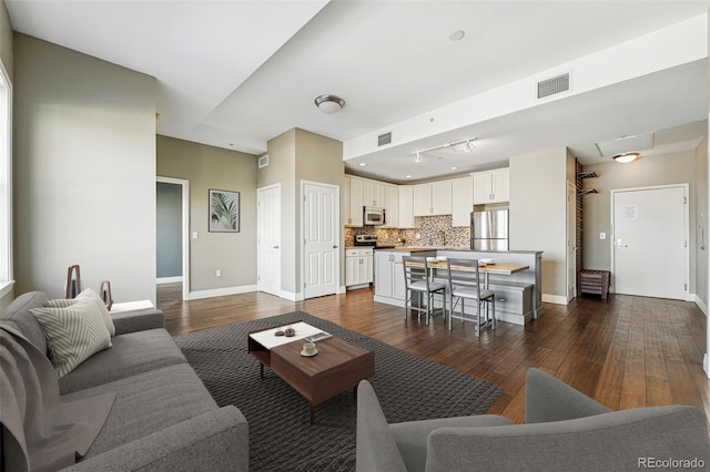 1950 N Logan St Unit 1109, Denver, CO 80203 - living room featuring dark wood finished floors and baseboards