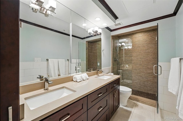 1950 N Logan St Unit 1109, Denver, CO 80203 - bathroom featuring crown molding, a shower stall, toilet, double vanity, and recessed lighting