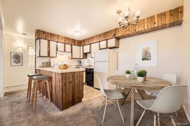 kitchen featuring light carpet, white appliances, under cabinet range hood, and light countertops