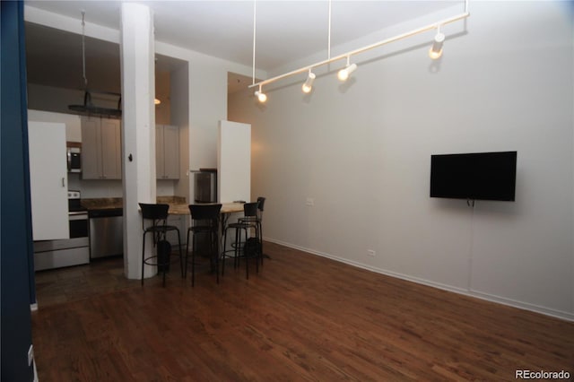 720 16th St Unit 513, Denver, CO 80202 - dining space with dark wood-style floors and baseboards