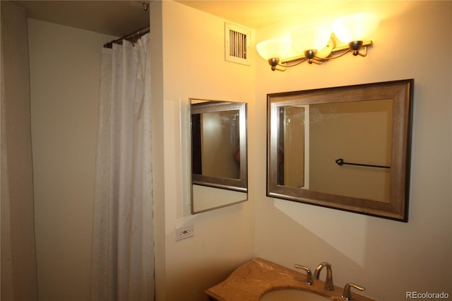720 16th St Unit 513, Denver, CO 80202 - bathroom featuring a chandelier and vanity