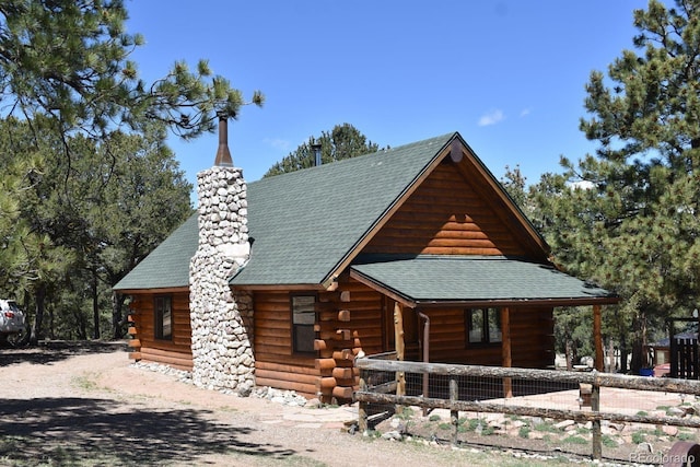 988 15th Trl, Cotopaxi, CO 81223 - cabin with a chimney, a shingled roof, and log siding