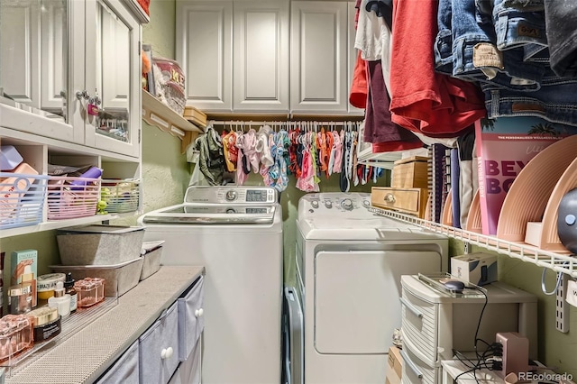 5704 Ammons St, Arvada, CO 80002 - washroom with washing machine and clothes dryer and cabinet space