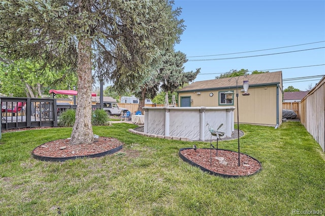 5704 Ammons St, Arvada, CO 80002 - view of yard featuring an outdoor pool and a wooden deck