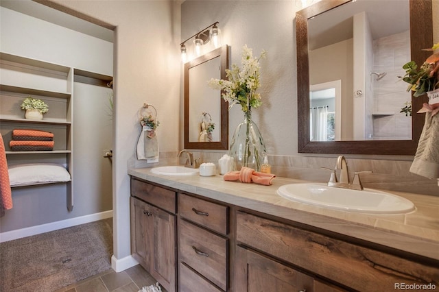 bathroom with tile flooring, backsplash, and dual vanity