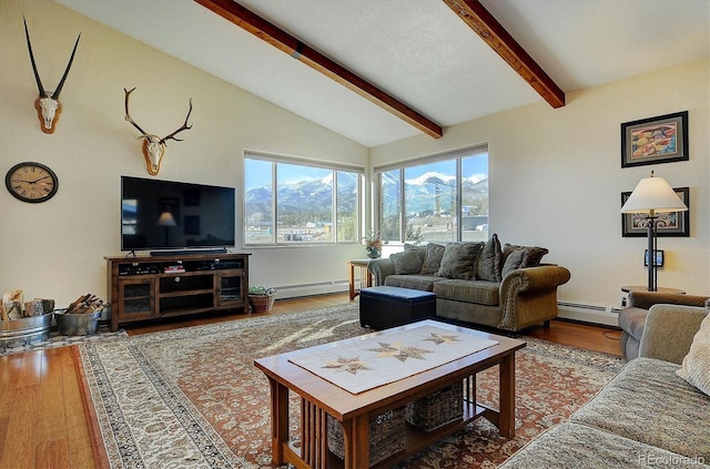 living room featuring vaulted ceiling with beams, baseboard heating, and wood finished floors