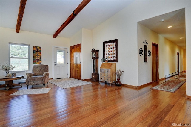 foyer with baseboards, lofted ceiling with beams, light wood-type flooring, a baseboard heating unit, and recessed lighting