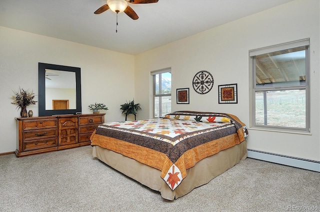 bedroom with carpet, ceiling fan, a baseboard radiator, and baseboards