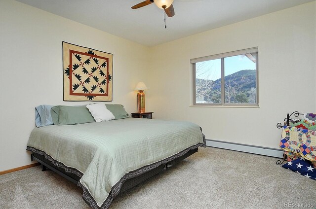42 Holiday Hills Blvd, Howard, CO 81233 - carpeted bedroom with ceiling fan, baseboards, and baseboard heating