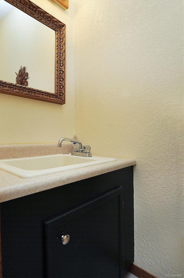 42 Holiday Hills Blvd, Howard, CO 81233 - bathroom featuring vanity and a textured wall
