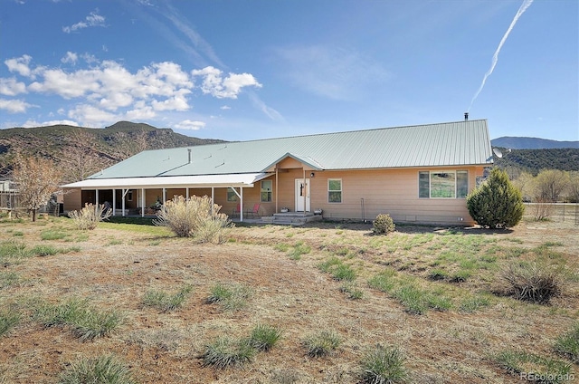 42 Holiday Hills Blvd, Howard, CO 81233 - view of front of house featuring a mountain view and metal roof
