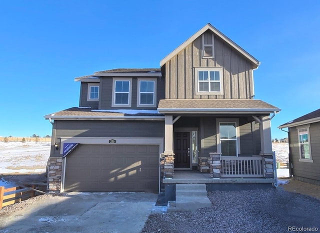 view of front of home with a porch and a garage