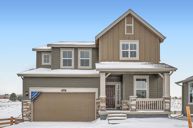 view of front facade with a garage and a porch