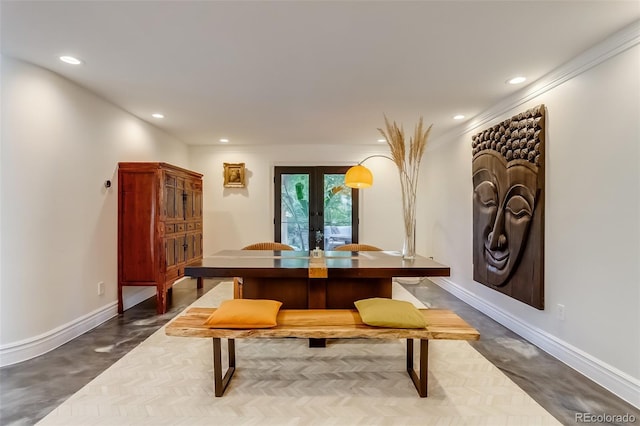 dining room with ornamental molding and french doors