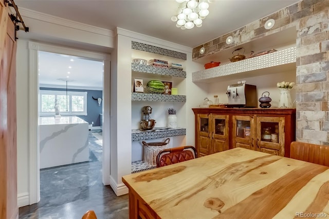 interior space with crown molding, an inviting chandelier, and wood counters