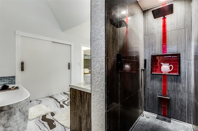 bathroom with vaulted ceiling, plus walk in shower, and vanity