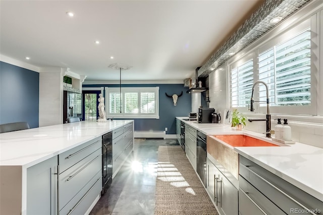 kitchen featuring plenty of natural light, gray cabinetry, light stone countertops, and a baseboard radiator