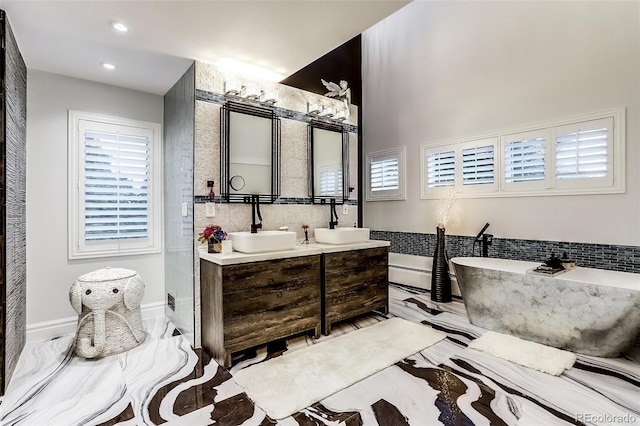 bathroom featuring vanity and a bathtub