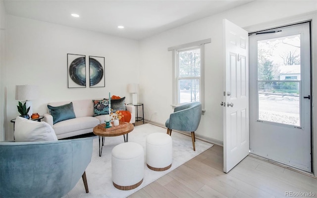living area featuring recessed lighting and light wood-type flooring