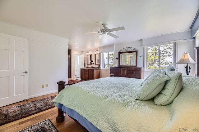 6451 Crestbrook Dr, Morrison, CO 80465 - bedroom with wood finished floors, baseboards, and a ceiling fan