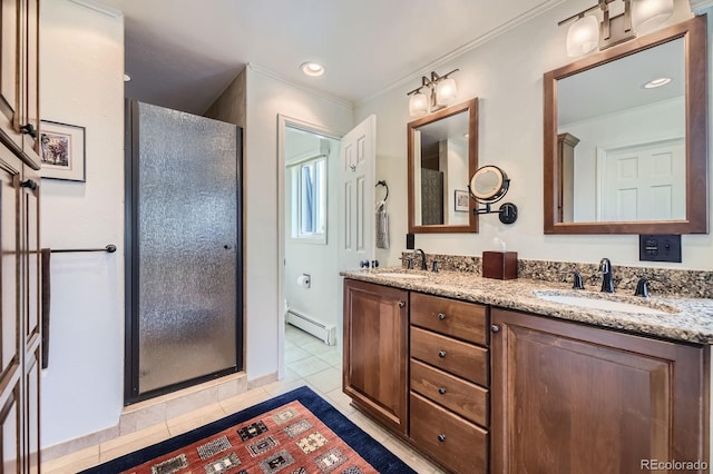 6451 Crestbrook Dr, Morrison, CO 80465 - bathroom featuring a baseboard radiator, a shower stall, double vanity, tile patterned flooring, and ornamental molding