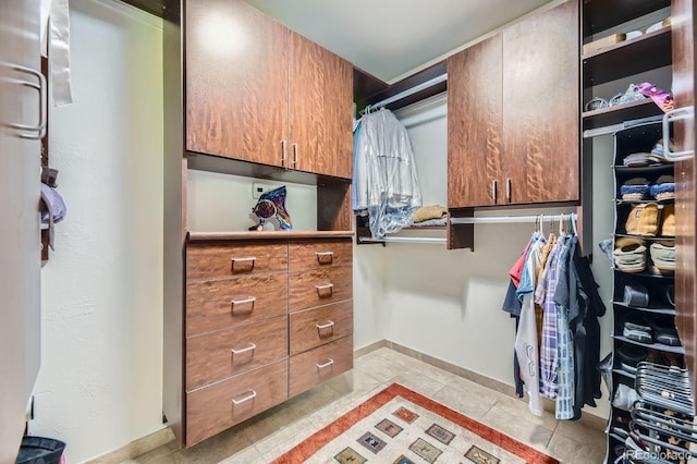 6451 Crestbrook Dr, Morrison, CO 80465 - walk in closet with light tile patterned flooring