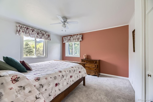 6451 Crestbrook Dr, Morrison, CO 80465 - carpeted bedroom with ornamental molding, baseboards, and ceiling fan