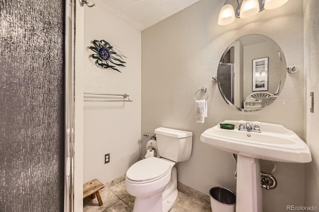 6451 Crestbrook Dr, Morrison, CO 80465 - bathroom with toilet and baseboards