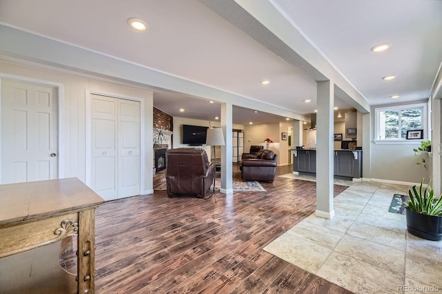 6451 Crestbrook Dr, Morrison, CO 80465 - living room featuring wood finished floors, baseboards, and recessed lighting