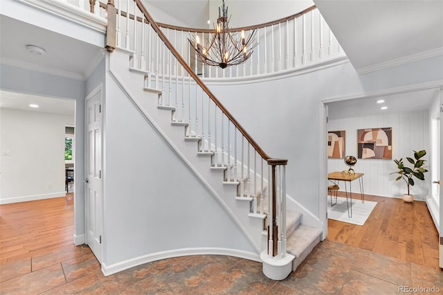 6451 Crestbrook Dr, Morrison, CO 80465 - stairs with crown molding, a chandelier, and stone finish flooring
