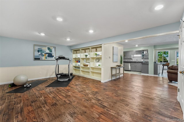 6451 Crestbrook Dr, Morrison, CO 80465 - workout area featuring dark wood finished floors, wainscoting, and recessed lighting