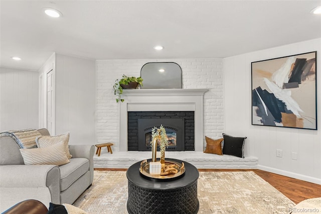 6451 Crestbrook Dr, Morrison, CO 80465 - living area featuring wood finished floors and a brick fireplace