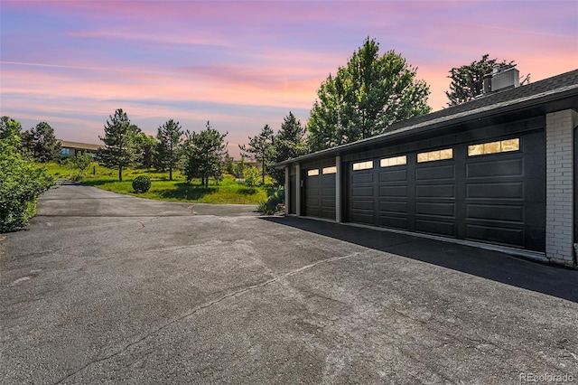 6451 Crestbrook Dr, Morrison, CO 80465 - view of garage at dusk
