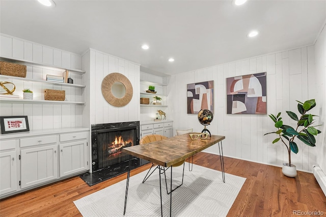 6451 Crestbrook Dr, Morrison, CO 80465 - office featuring a multi sided fireplace, light wood finished floors, and recessed lighting