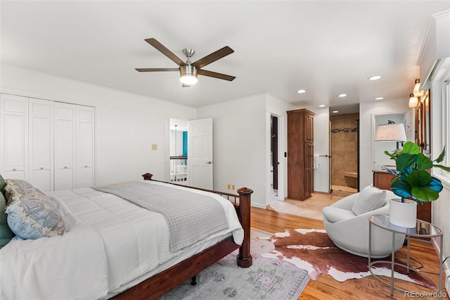 6451 Crestbrook Dr, Morrison, CO 80465 - bedroom featuring light wood-style floors, recessed lighting, a ceiling fan, a closet, and connected bathroom