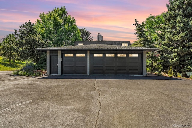 6451 Crestbrook Dr, Morrison, CO 80465 - view of garage at dusk