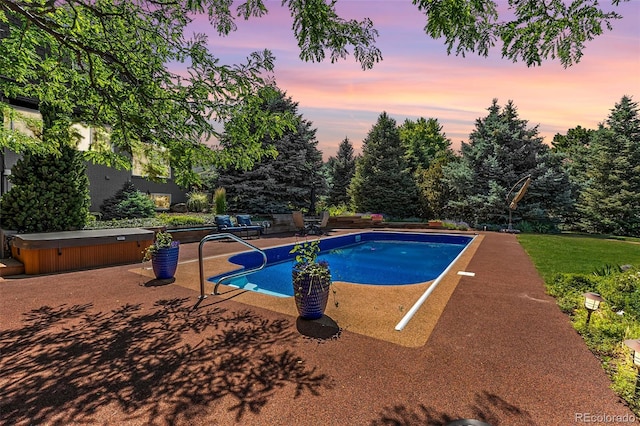 6451 Crestbrook Dr, Morrison, CO 80465 - pool at dusk with a hot tub, a patio, and an outdoor pool