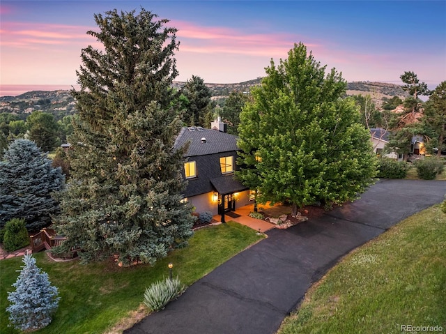 6451 Crestbrook Dr, Morrison, CO 80465 - view of side of property featuring a lawn