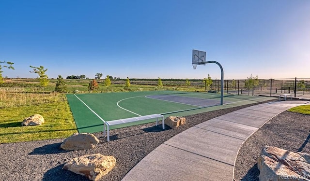 view of basketball court with a rural view