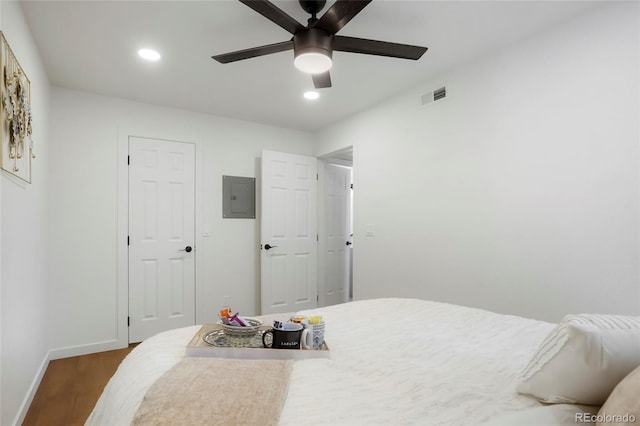 8701 Huron St Unit 2-106, Thornton, CO 80260 - bedroom featuring electric panel, dark wood-style floors, recessed lighting, and a ceiling fan