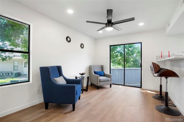 8701 Huron St Unit 2-106, Thornton, CO 80260 - living area with plenty of natural light, wood finished floors, ceiling fan, and recessed lighting