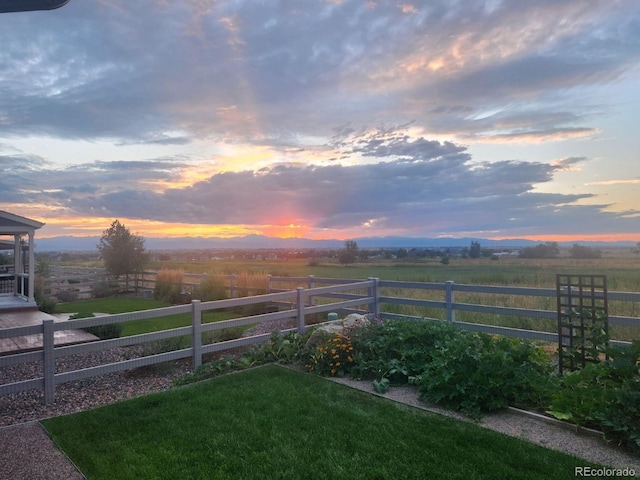 2355 Saddle Back Ct, Fort Lupton, CO 80621 - yard at dusk featuring fence and a rural view