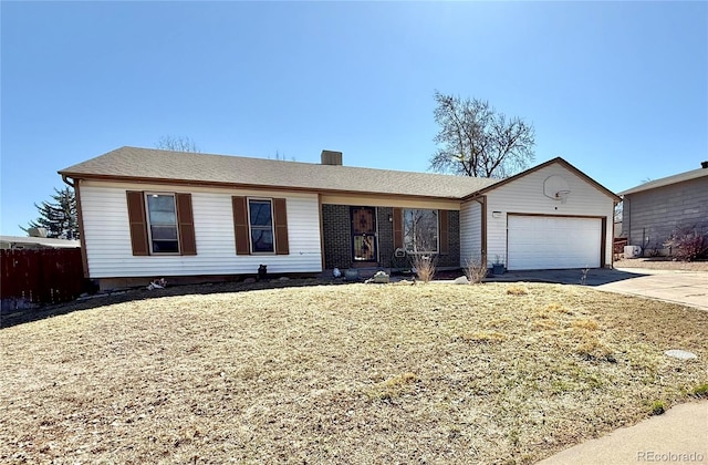 ranch-style house featuring a front lawn, concrete driveway, and an attached garage