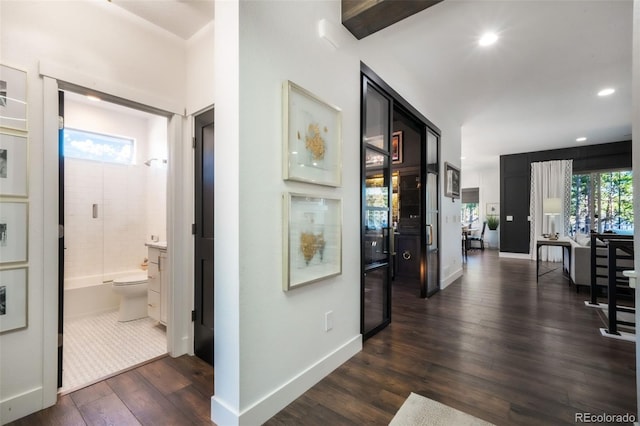 1004 Tree Bark Ter, Colorado Springs, CO 80921 - corridor featuring dark wood-style flooring, recessed lighting, and baseboards
