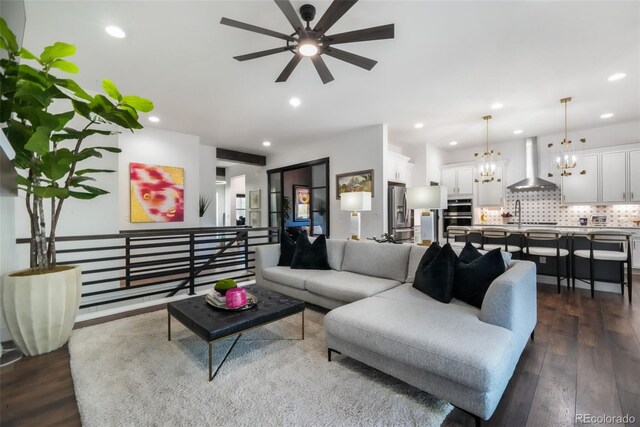 1004 Tree Bark Ter, Colorado Springs, CO 80921 - living area with a chandelier, a ceiling fan, dark wood-style flooring, and recessed lighting