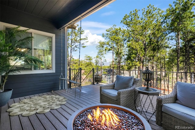 1004 Tree Bark Ter, Colorado Springs, CO 80921 - wooden terrace with a fire pit