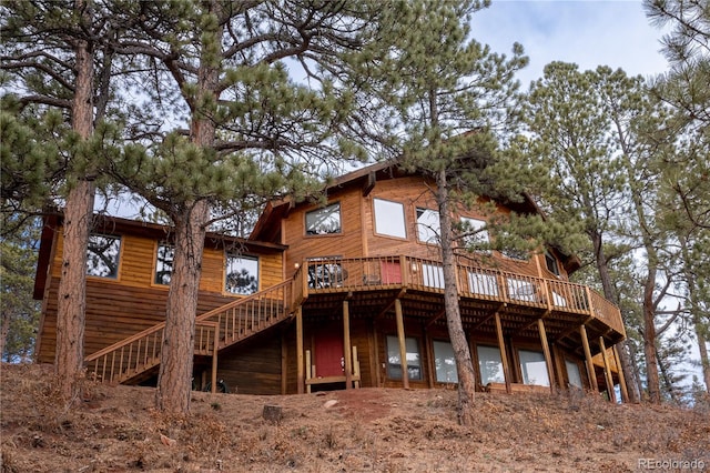 back of property with a wooden deck