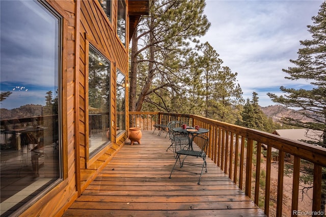 wooden terrace with a mountain view