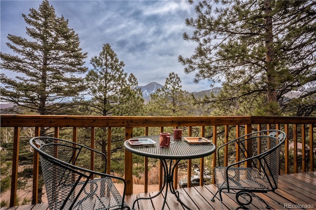 wooden deck featuring a mountain view