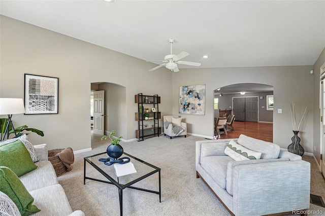 3570 E Arapahoe Pl, Centennial, CO 80122 - carpeted living area featuring arched walkways, ceiling fan, baseboards, and recessed lighting